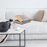 Braune Laptopunterlage COMFILAP III mit grauem Kissen auf einem hellen Sofa von hjh OFFICE