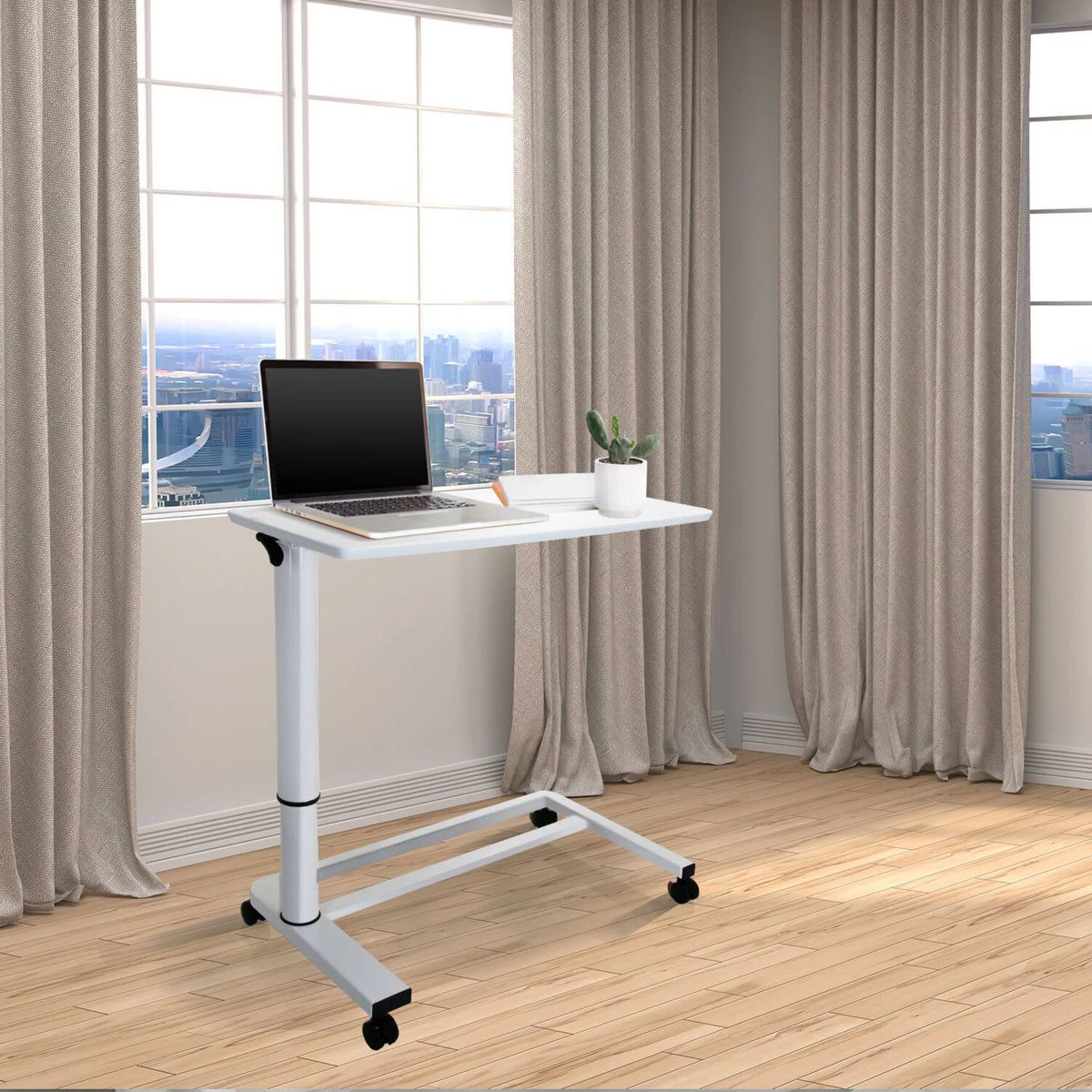 Weißer Stehschreibtisch STAND II mit Rollen und Laptop auf einer hellen Holzbodengruppe von hjh OFFICE