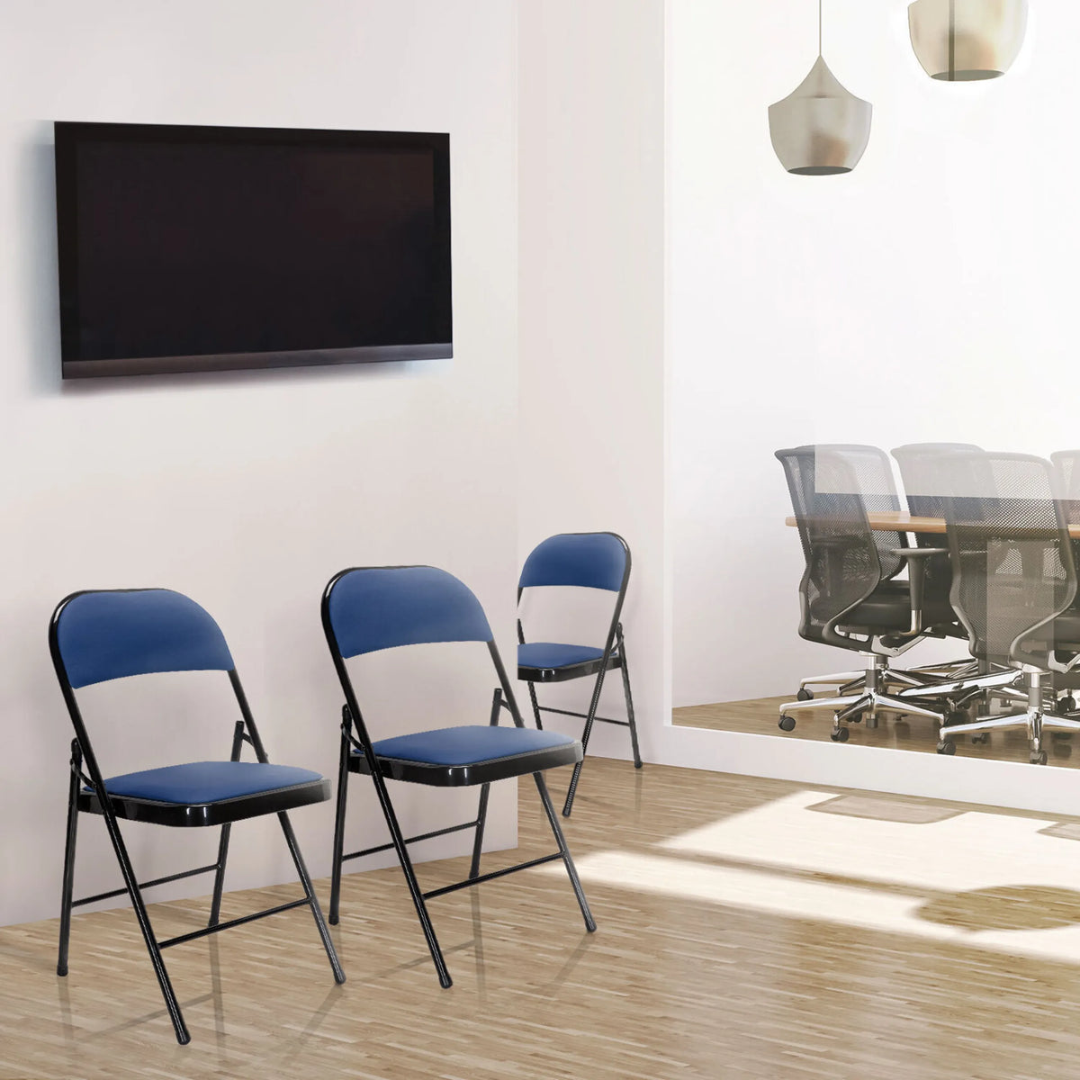 Drei blaue Klappstühle TUDELA mit Bezügen aus Kunstleder und schwarzem Gestell von hjh OFFICE